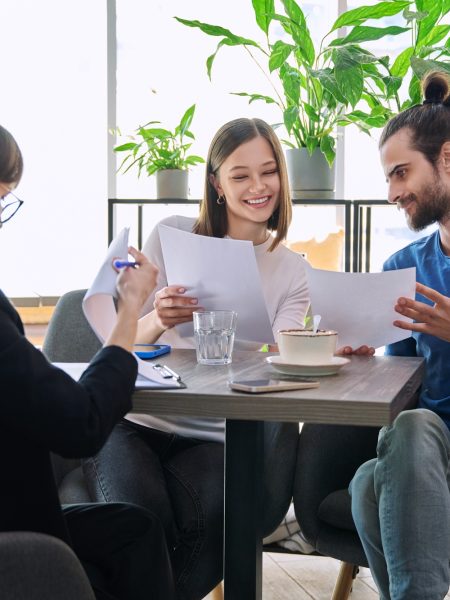 Wedding travel manager, realtor broker, bank insurance agent working with young couple